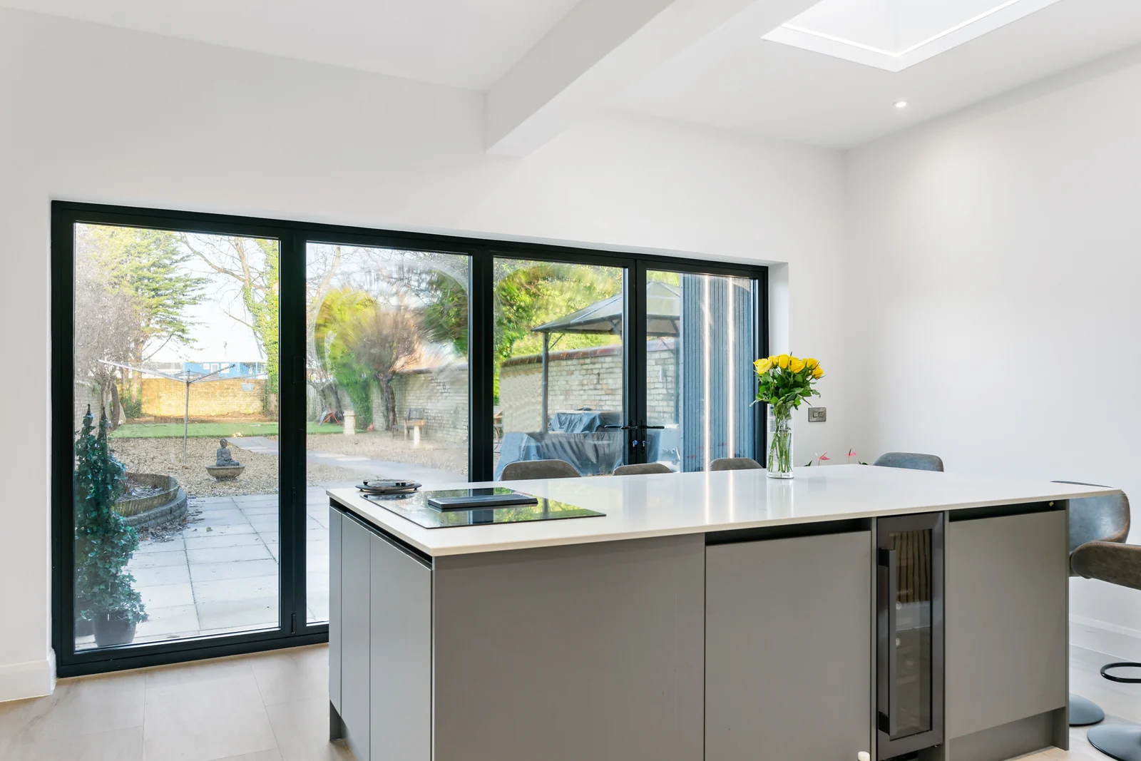 Finished kitchen extension with island and bifold doors
