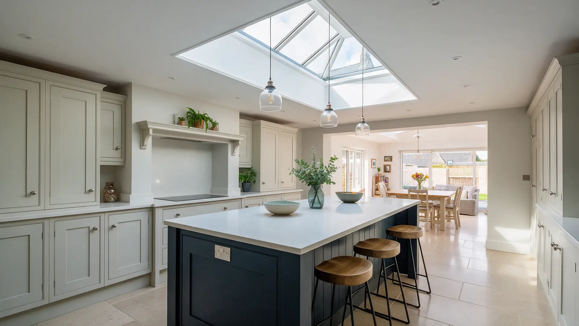 Shaker style kitchen with quartz worktops, island and roof lantern