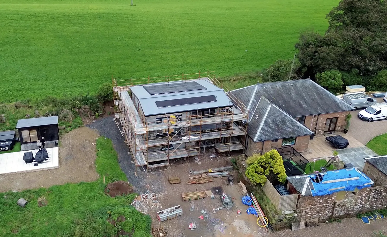 Aerial view of a scaffolded two storey extension run by Cutwood Joinery & Construction as principal contractor